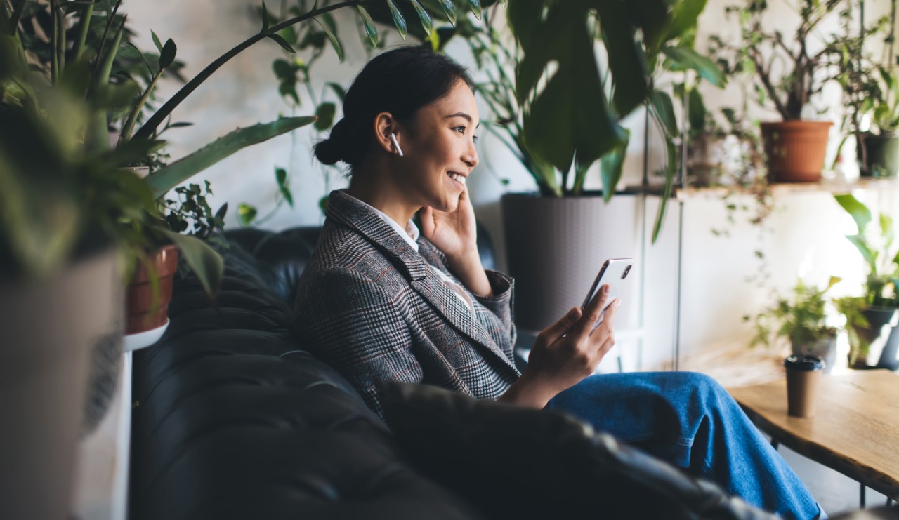 Woman listening to airpods