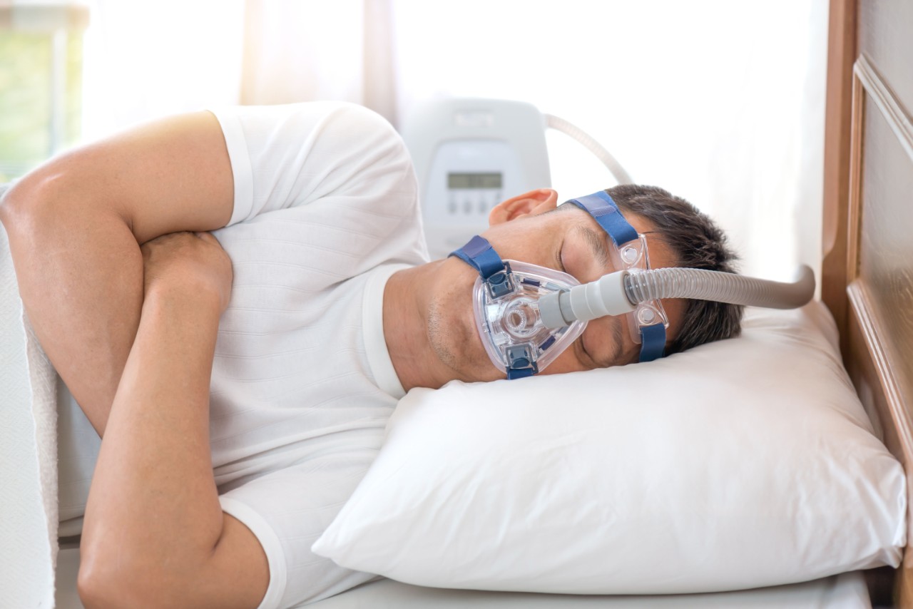 Man sleeping with CPAP 