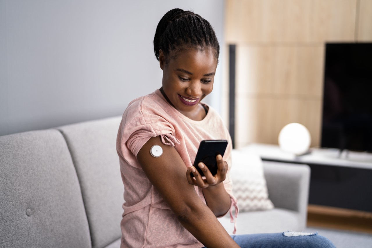 Woman testing glucose level