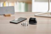 Hearing aids and phone on a desk